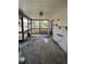 Enclosed porch with screens and a ceiling fan at 8152 Robert St, Englewood, FL 34224