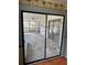 View of the screened porch from inside the home at 8152 Robert St, Englewood, FL 34224