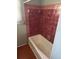 Shower featuring tiled walls and a standard tub at 8152 Robert St, Englewood, FL 34224