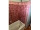 Shower featuring tiled walls and a standard shower head and faucet at 8152 Robert St, Englewood, FL 34224