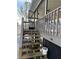 Exterior stairs leading to an enclosed porch at 8152 Robert St, Englewood, FL 34224