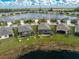Aerial view of property featuring a screened in pool, large backyard, and lake view at 7049 Waterford Pkwy, Punta Gorda, FL 33950