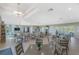 Bright clubhouse interior featuring ample seating, tables, and a communal area for residents at 7049 Waterford Pkwy, Punta Gorda, FL 33950