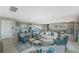 Inviting clubhouse interior with comfortable seating, a kitchenette, and tables for gatherings at 7049 Waterford Pkwy, Punta Gorda, FL 33950