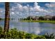 Picturesque pond with a fountain surrounded by well-maintained lawns and homes in the Waterford community at 7049 Waterford Pkwy, Punta Gorda, FL 33950