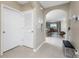Neutral colored entryway features ceramic floors, an arched doorway and an open view to the dining room at 7049 Waterford Pkwy, Punta Gorda, FL 33950