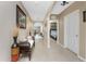 Inviting entryway featuring neutral walls, ceramic tile floors, and an arched doorway leading to the living area at 7049 Waterford Pkwy, Punta Gorda, FL 33950