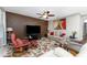Living room showcasing an accent wall, ceiling fan and comfortable recliner and couch at 7049 Waterford Pkwy, Punta Gorda, FL 33950