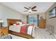 Main bedroom with a wood accent wall and ceiling fan at 7049 Waterford Pkwy, Punta Gorda, FL 33950