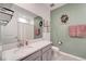 Well-lit bathroom featuring a large vanity, framed wall art, and fresh, neutral tones at 11637 Woodleaf Dr # 11637, Bradenton, FL 34211