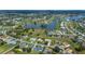 Aerial view of property showcasing a lake view and neighborhood at 1212 Yachtsman Ln, Punta Gorda, FL 33983