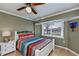 Comfortable bedroom showcases a ceiling fan, a window, and a full-sized bed at 1212 Yachtsman Ln, Punta Gorda, FL 33983