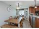 Dining area featuring wood table, bench seating, and natural light from window at 1212 Yachtsman Ln, Punta Gorda, FL 33983