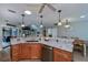 Kitchen featuring granite countertops, wood cabinets, and stainless steel dishwasher at 1212 Yachtsman Ln, Punta Gorda, FL 33983