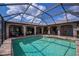 Relaxing screened-in pool area with a covered patio and multiple seating areas for outdoor enjoyment at 1212 Yachtsman Ln, Punta Gorda, FL 33983