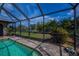 Refreshing pool with screened enclosure, offering clear views of the well-maintained yard at 1212 Yachtsman Ln, Punta Gorda, FL 33983