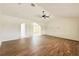 Large living room featuring wood-look tile flooring and a view of the front entrance at 1259 Royal Tern Dr, Punta Gorda, FL 33950