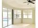 Bright and airy living room with sliding glass doors leading to the pool area, offering scenic views at 1259 Royal Tern Dr, Punta Gorda, FL 33950