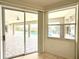 View of the pool from inside the enclosed porch with tile flooring at 1259 Royal Tern Dr, Punta Gorda, FL 33950