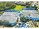 Aerial view of tennis courts, playground, and outdoor recreation spaces at 1578 Scarlett Ave, North Port, FL 34289