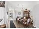 Spacious dining room featuring hardwood floors, a decorative light fixture, and a dark floor mat at 1578 Scarlett Ave, North Port, FL 34289