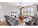 Cozy living room featuring wood flooring, a large television and comfortable leather seating at 1578 Scarlett Ave, North Port, FL 34289