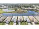 Aerial view of lakeside homes surrounded by lush landscaping and a golf course at 1620 Lancashire Dr, Venice, FL 34293