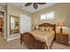 Well-lit bedroom featuring wood furniture, neutral walls, and a spacious closet at 1620 Lancashire Dr, Venice, FL 34293