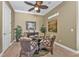 Charming dining area with a round table, wicker chairs, and a relaxed atmosphere at 1620 Lancashire Dr, Venice, FL 34293