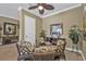 Inviting dining area with seating for four, decorative plants, and ample natural light at 1620 Lancashire Dr, Venice, FL 34293