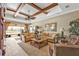 Cozy living room with neutral tones, comfortable sofas, and a view of the outdoor space at 1620 Lancashire Dr, Venice, FL 34293