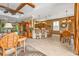 Stylish living space showcasing a coffered ceiling, a kitchen with bar seating, and a formal dining area at 1620 Lancashire Dr, Venice, FL 34293