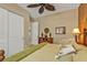 Comfortable bedroom with wood furniture, large closet, and neutral walls at 1620 Lancashire Dr, Venice, FL 34293