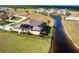 An aerial shot highlighting a beautiful home with solar panels and waterfront view at 17122 Barcrest Ln, Punta Gorda, FL 33955