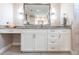 A bathroom vanity featuring stone countertops, white cabinetry, a makeup area and stylish lighting at 17122 Barcrest Ln, Punta Gorda, FL 33955