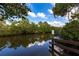 A serene view of the waterway surrounded by mangroves and lush greenery at 17122 Barcrest Ln, Punta Gorda, FL 33955