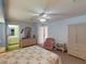 Spacious bedroom with pastel walls, carpet, and a ceiling fan at 1727 Boca Raton Ct, Punta Gorda, FL 33950