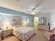 Spacious bedroom with pastel walls, carpet, and a ceiling fan at 1727 Boca Raton Ct, Punta Gorda, FL 33950