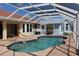 A beautiful screened-in pool and patio area make for the perfect outdoor space at 1727 Boca Raton Ct, Punta Gorda, FL 33950