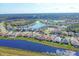 Extensive lakeside community aerial view featuring homes along waterways and surrounded by trees at 1771 Scarlett Ave, North Port, FL 34289