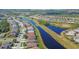 Aerial view of the lake and surrounding community homes at 1771 Scarlett Ave, North Port, FL 34289