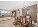 Elegant dining area with decorative rug adjoining the living room, and a view of the screened-in patio at 1771 Scarlett Ave, North Port, FL 34289