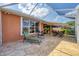 Exterior view of the screened-in lanai and outdoor lounge area at 1771 Scarlett Ave, North Port, FL 34289