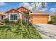 Charming single Gathering home with manicured landscaping and a two-car garage at 1771 Scarlett Ave, North Port, FL 34289