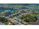 Aerial view of residential neighborhood with lake, golf course, and lush landscaping at 1800 Birmingham Blvd, Punta Gorda, FL 33980