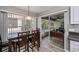 Dining area leading to a screened-in porch and tiled flooring at 1800 Birmingham Blvd, Punta Gorda, FL 33980