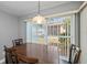 Dining area featuring a large table and sliding glass doors to the backyard at 1800 Birmingham Blvd, Punta Gorda, FL 33980