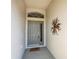 A welcoming front entrance showcasing a decorative door and a stylish welcome mat at 1800 Birmingham Blvd, Punta Gorda, FL 33980