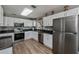 Modern kitchen featuring stainless steel appliances and white cabinets at 1800 Birmingham Blvd, Punta Gorda, FL 33980