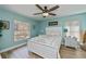 Serene main bedroom with wood floors, natural light, and a soothing color palette at 1800 Birmingham Blvd, Punta Gorda, FL 33980